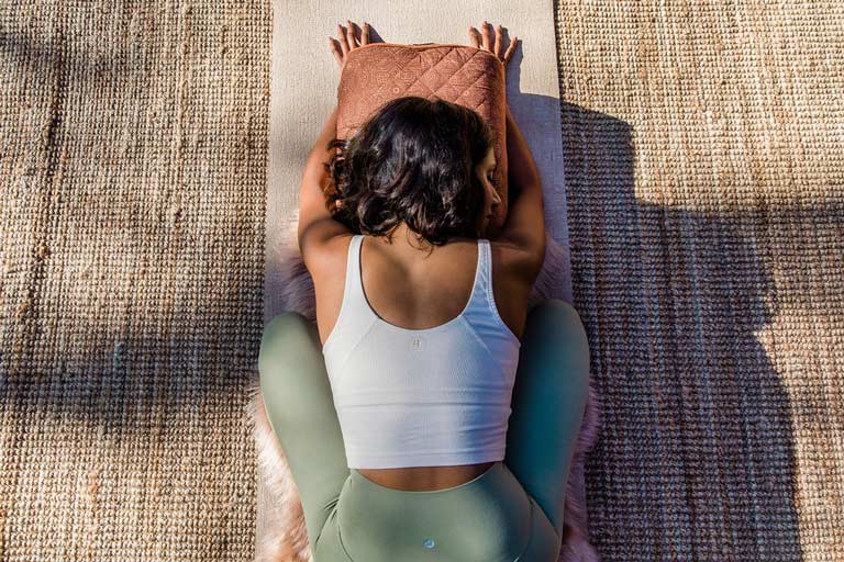 woman leaning forward in a yoga pose