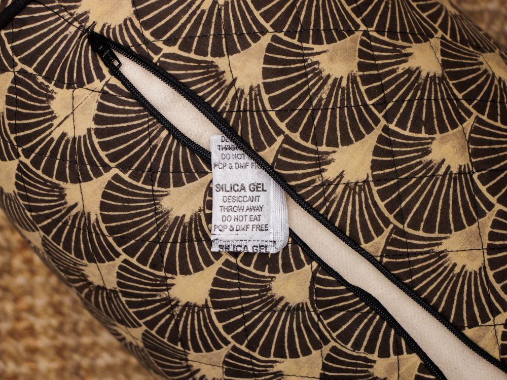 our bolsters are filled with kapok or 100% oganic cotton that may absorb some moisture in humid locations