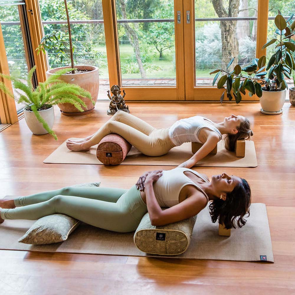 yogi in a supported matsyasana pose